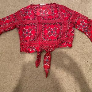 red tie top with flared sleeves